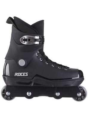 Feet of rollerblader wearing aggressive inline skates grinding on