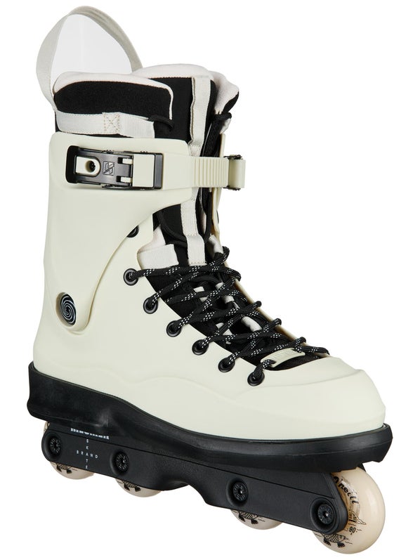 Angled view of an off-white aggressive skate with black laces with a circular logo by the heel.
