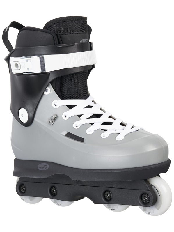 Side view of a gray and black aggressive inline skate with white wheels and laces.