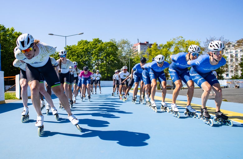 A large team of professional inline skaters