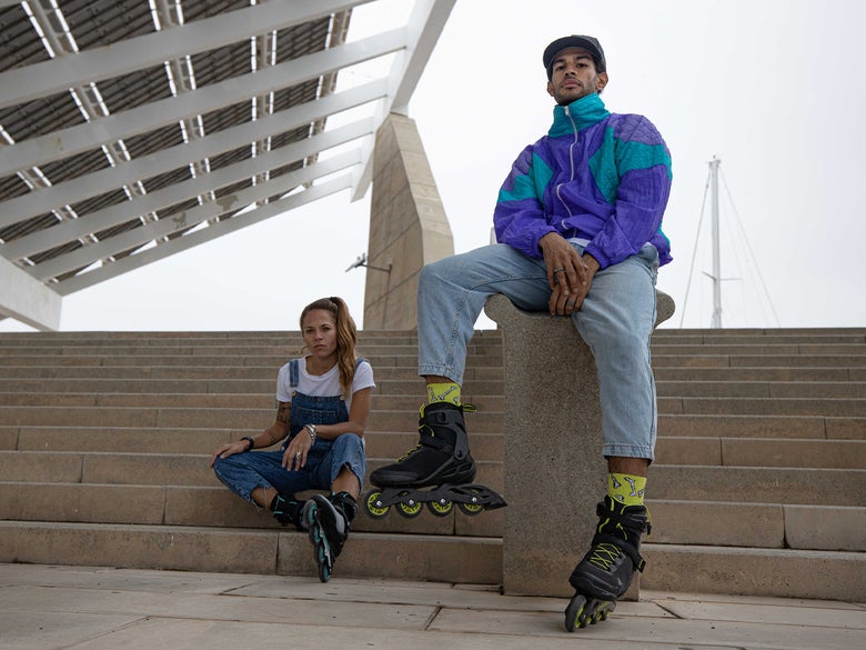 Two people, both wearing Rollerblade Macroblade Skates