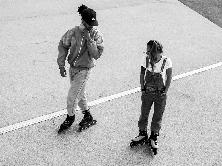 Two people, both wearing Rollerblade Macroblade Skates